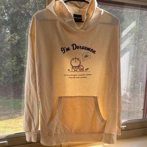 Cream Graphic Hoodie with Cartoon Print